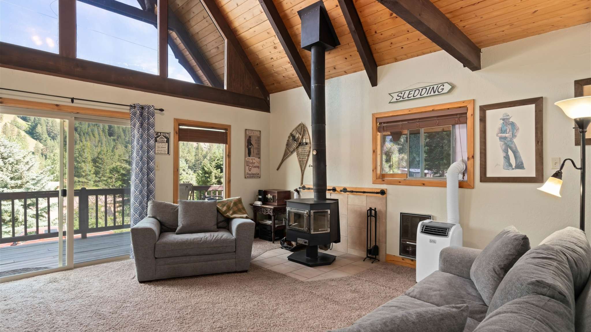 Enjoy the comfort of a cozy woodstove in the living area.