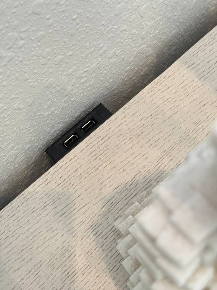 Each night stand and end table has USB charging ports. 