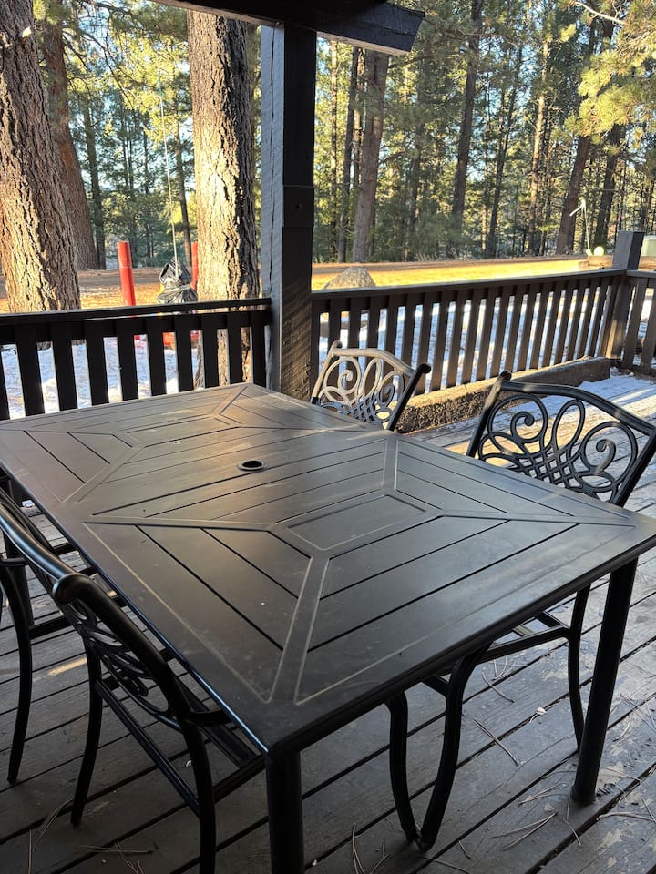 Outdoor dining table on deck