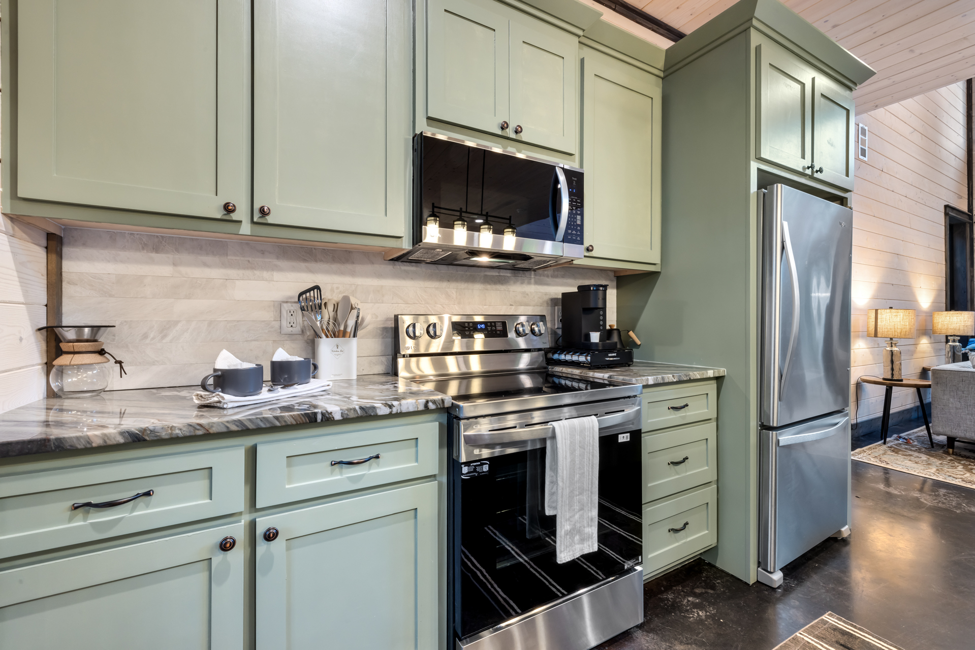 Modern fully equipped kitchen with everything needed for home-cooked meals and group dining, designed for convenience and easy entertaining.