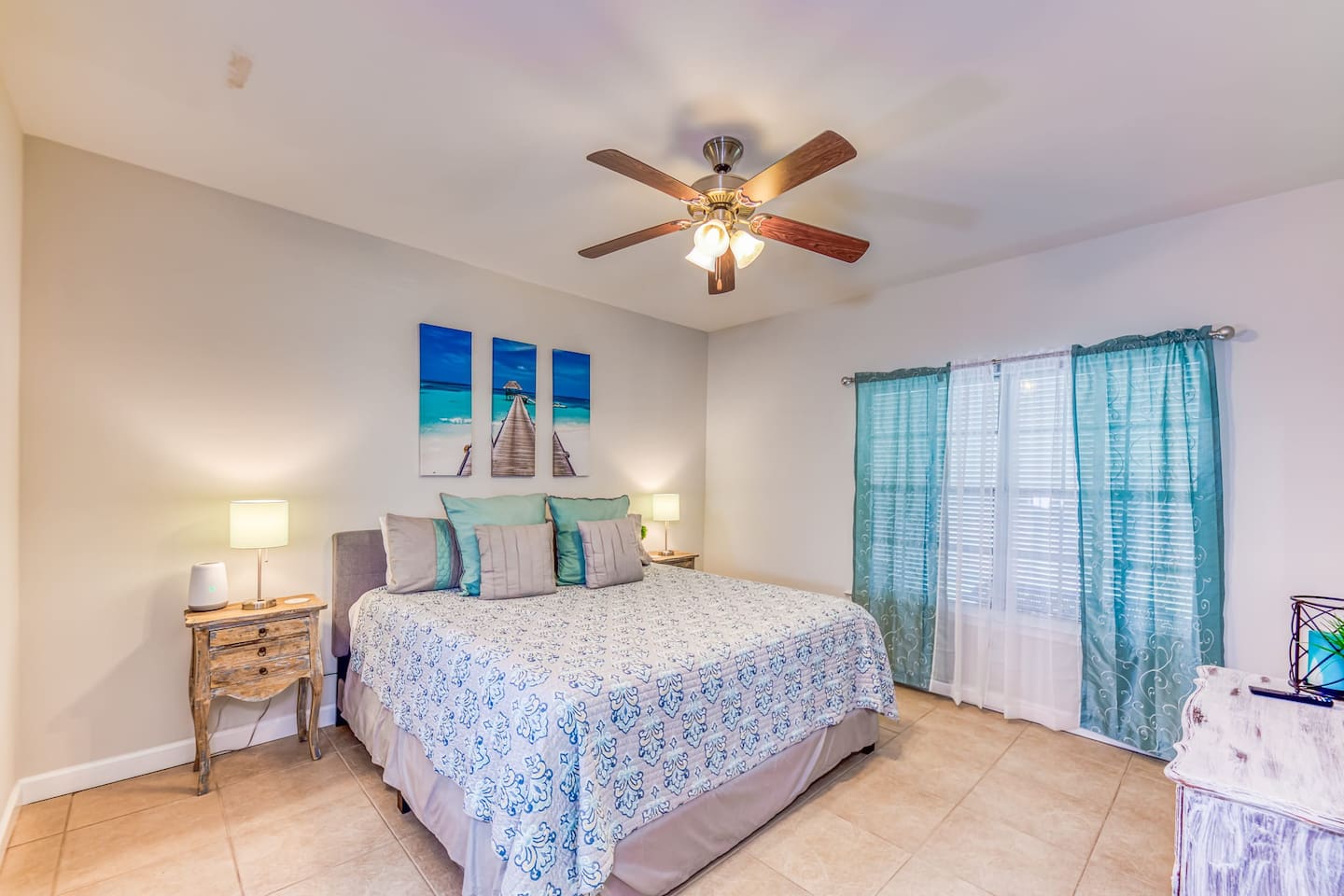Master Bedroom: Relax in this bright retreat with beachy decor and a comfy king-sized bed!