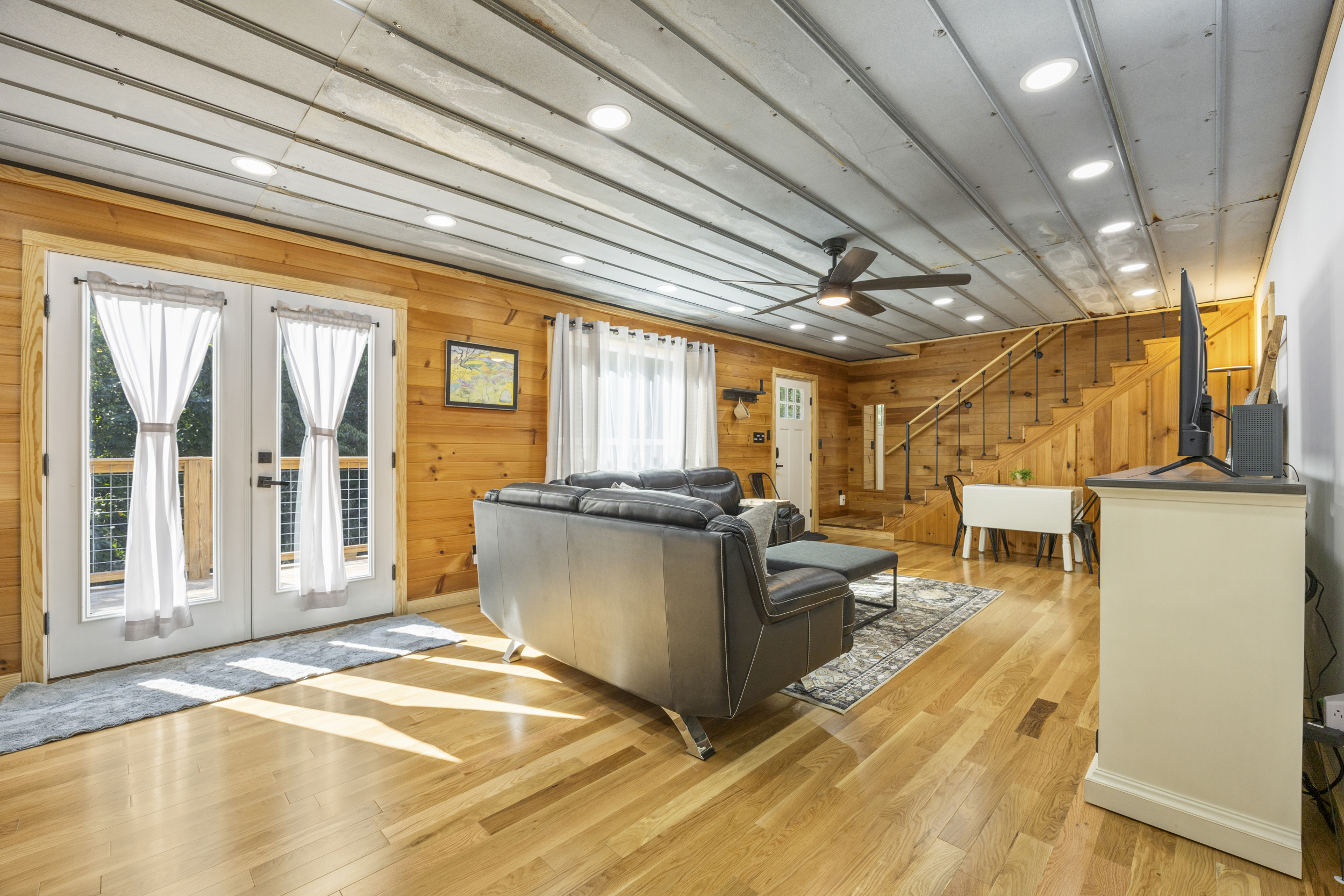 Dining area with seating for six and natural light — perfect for family meals or game nights.