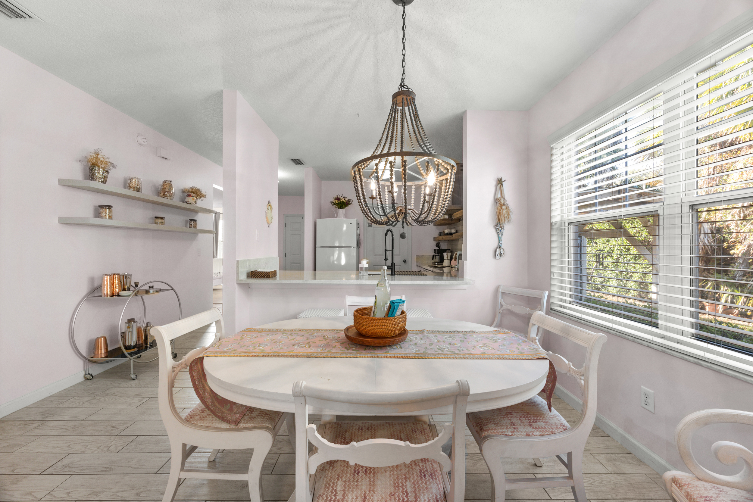 Sunny and welcoming dining room with a cozy vibe.