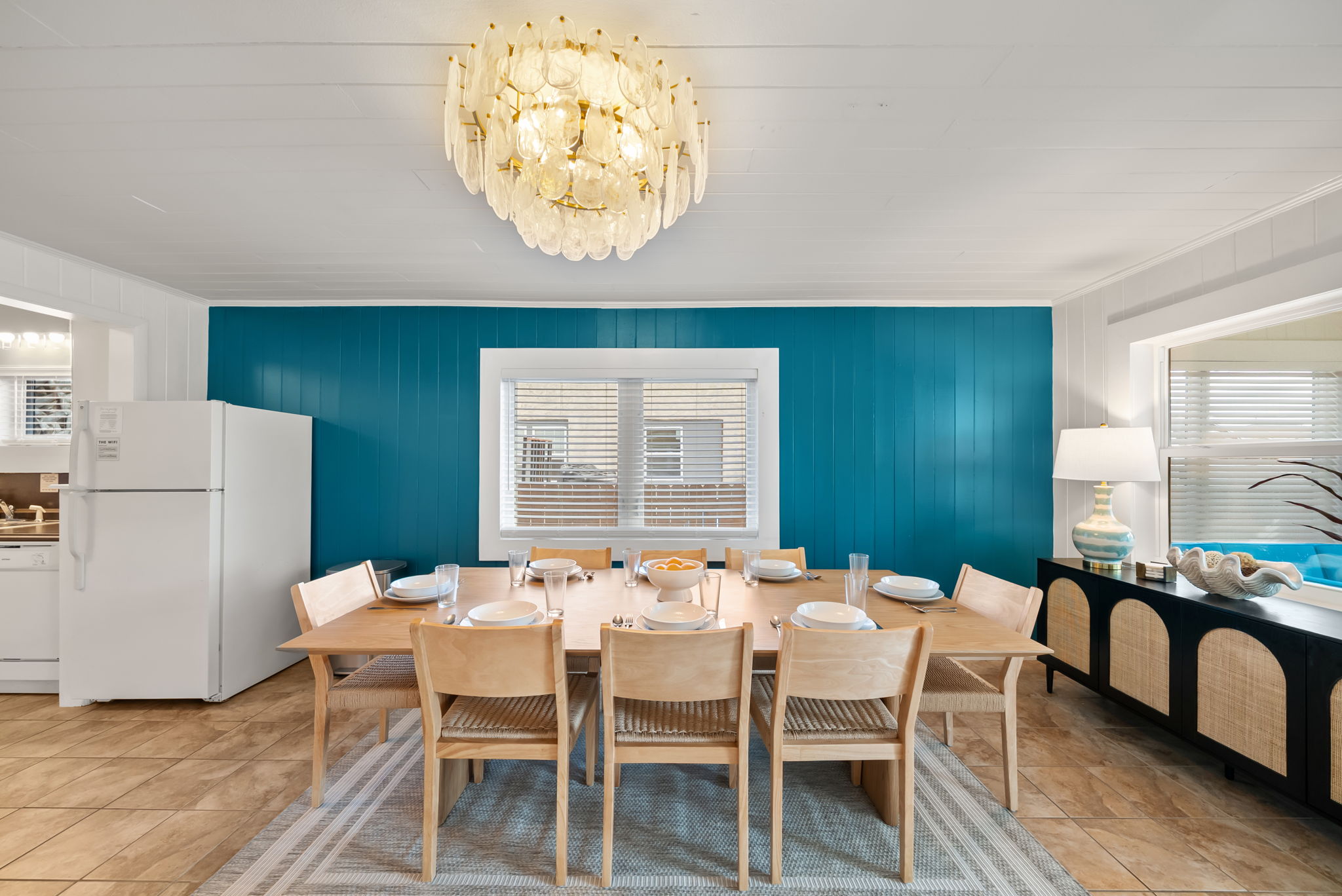 Pull up a chair! The dining table seats 10 under a sparkling chandelier, making family dinners, birthday toasts, and
late-night card games feel like the main event. We didn't forget about the little ones! A high-chair and booster seat are also provided!