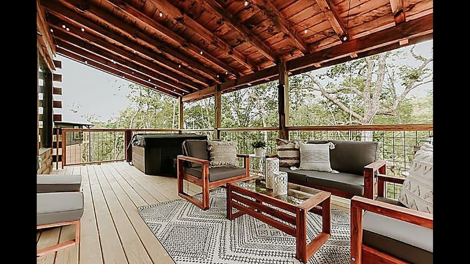 Enjoy meals al fresco on the covered deck, surrounded by fresh mountain air and treetop views