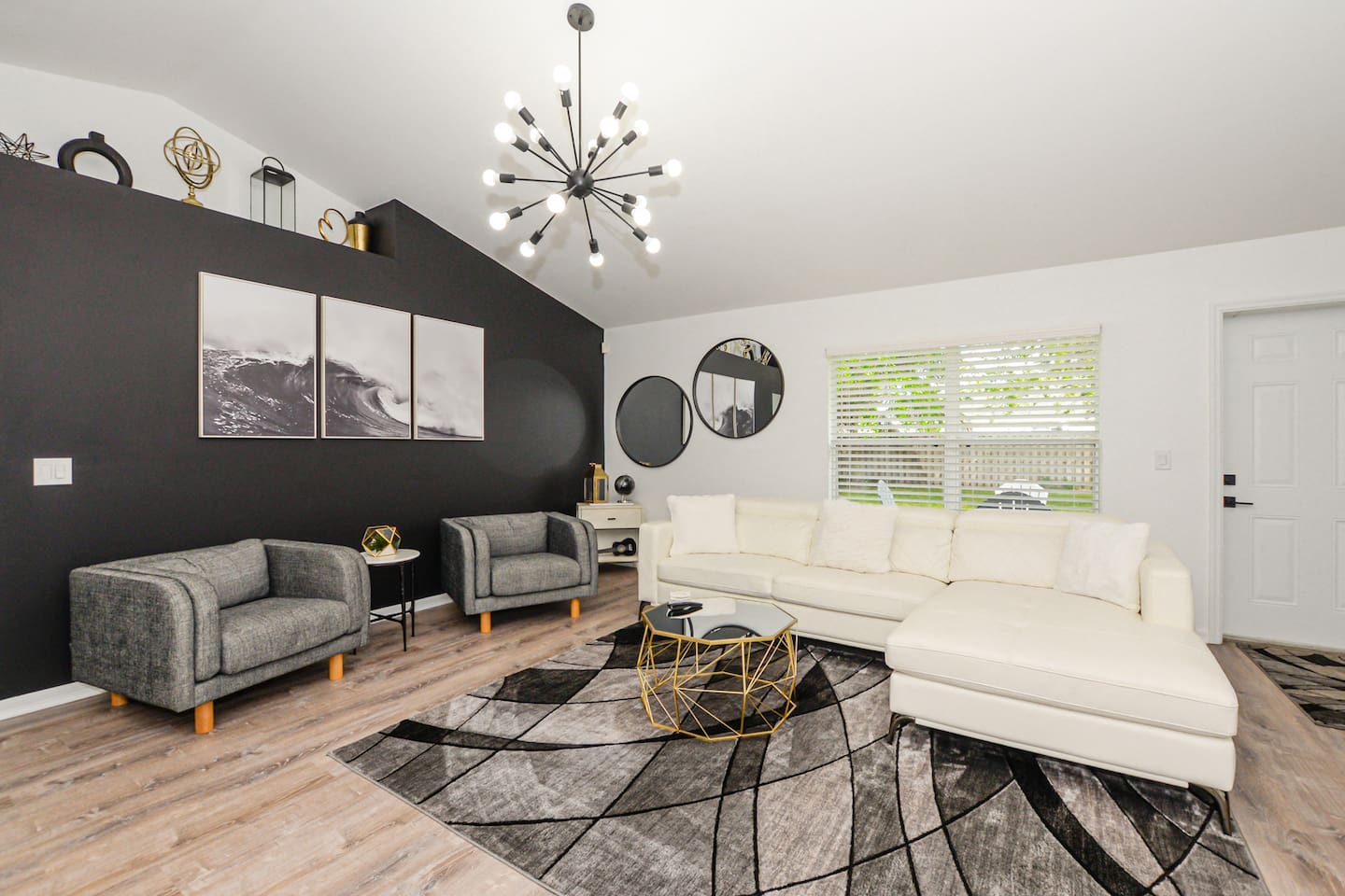 Elegant living space with stylish couches, modern décor, and a cozy ambiance.