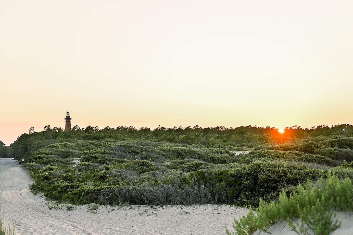 The neighborhood offers some lovely views of the sunset over the dunes and the local lighthouse in the distance.