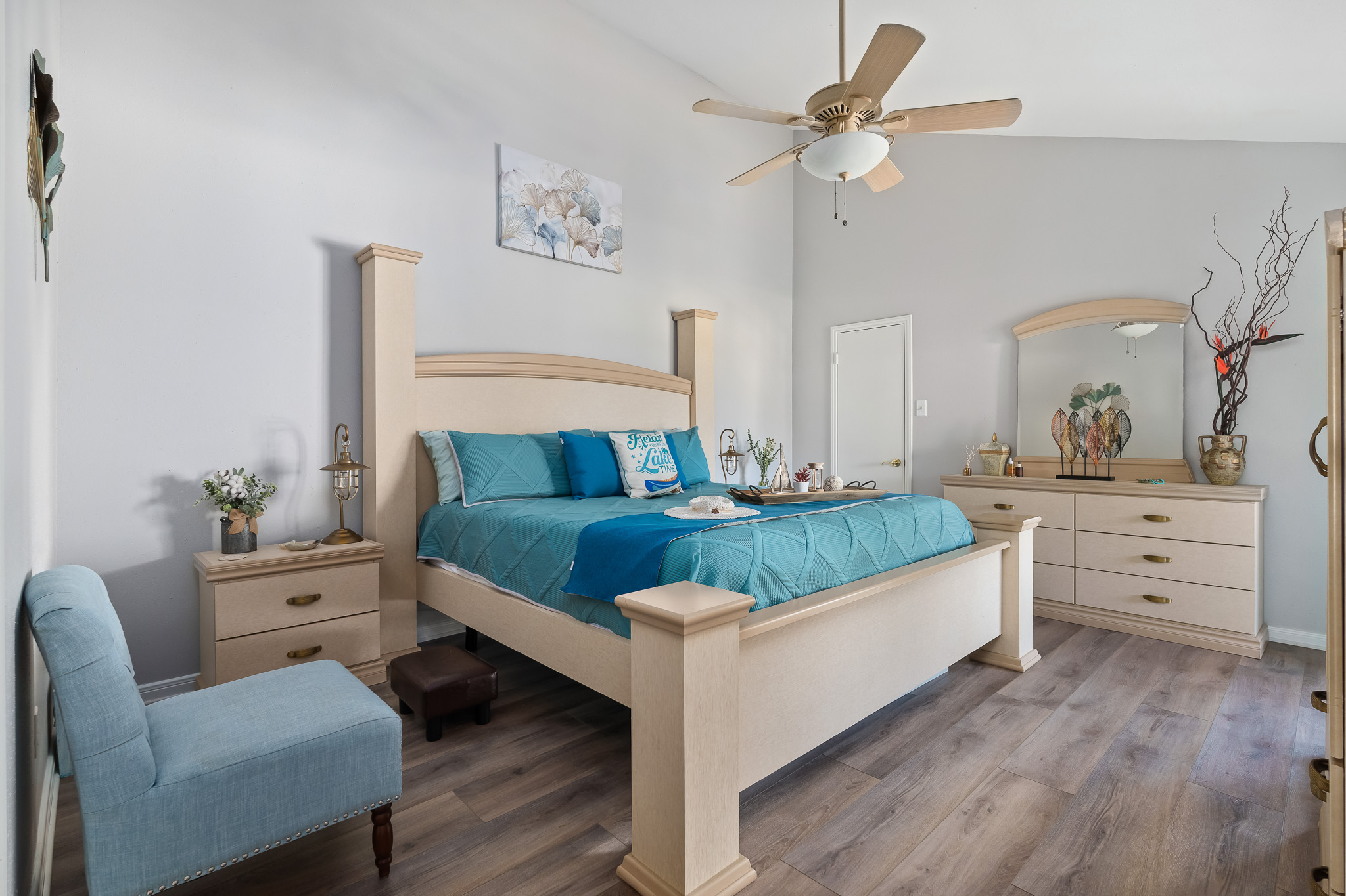 Relax and recharge in this spacious coastal-inspired master suite—where comfort meets calm for the perfect night’s sleep.