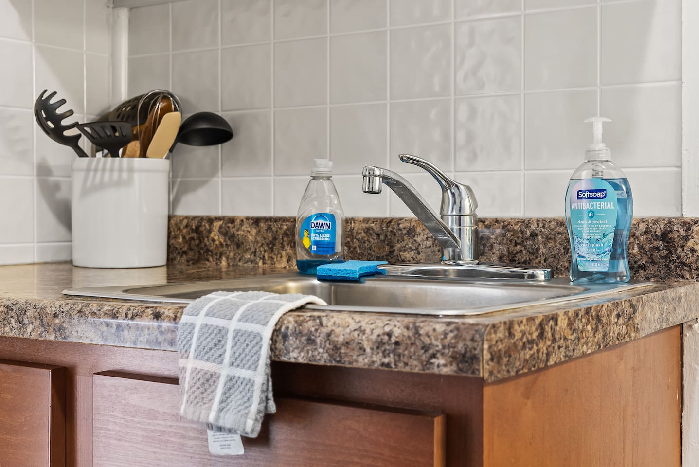 A tidy sink space stocked with the essentials for quick cleanups.