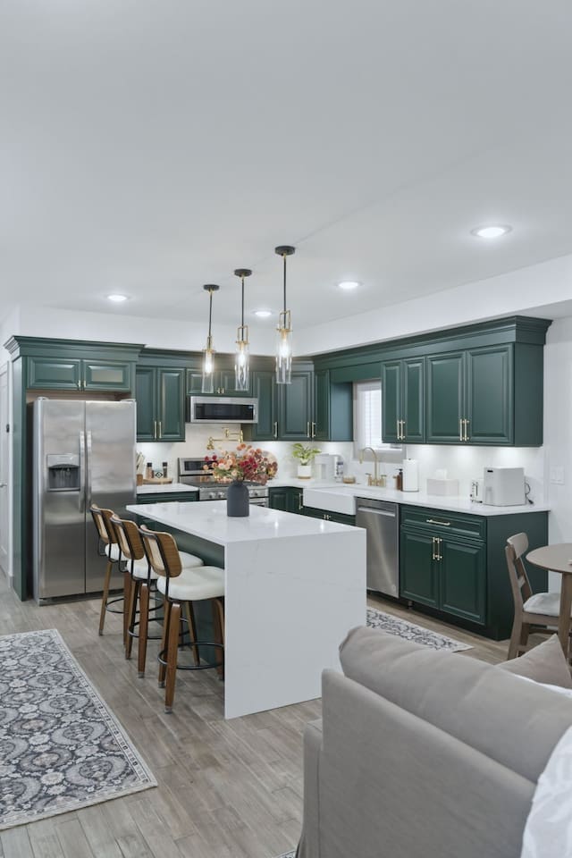 Elegant kitchen island with bar seating and stylish pendant lighting, creating a welcoming space to gather.