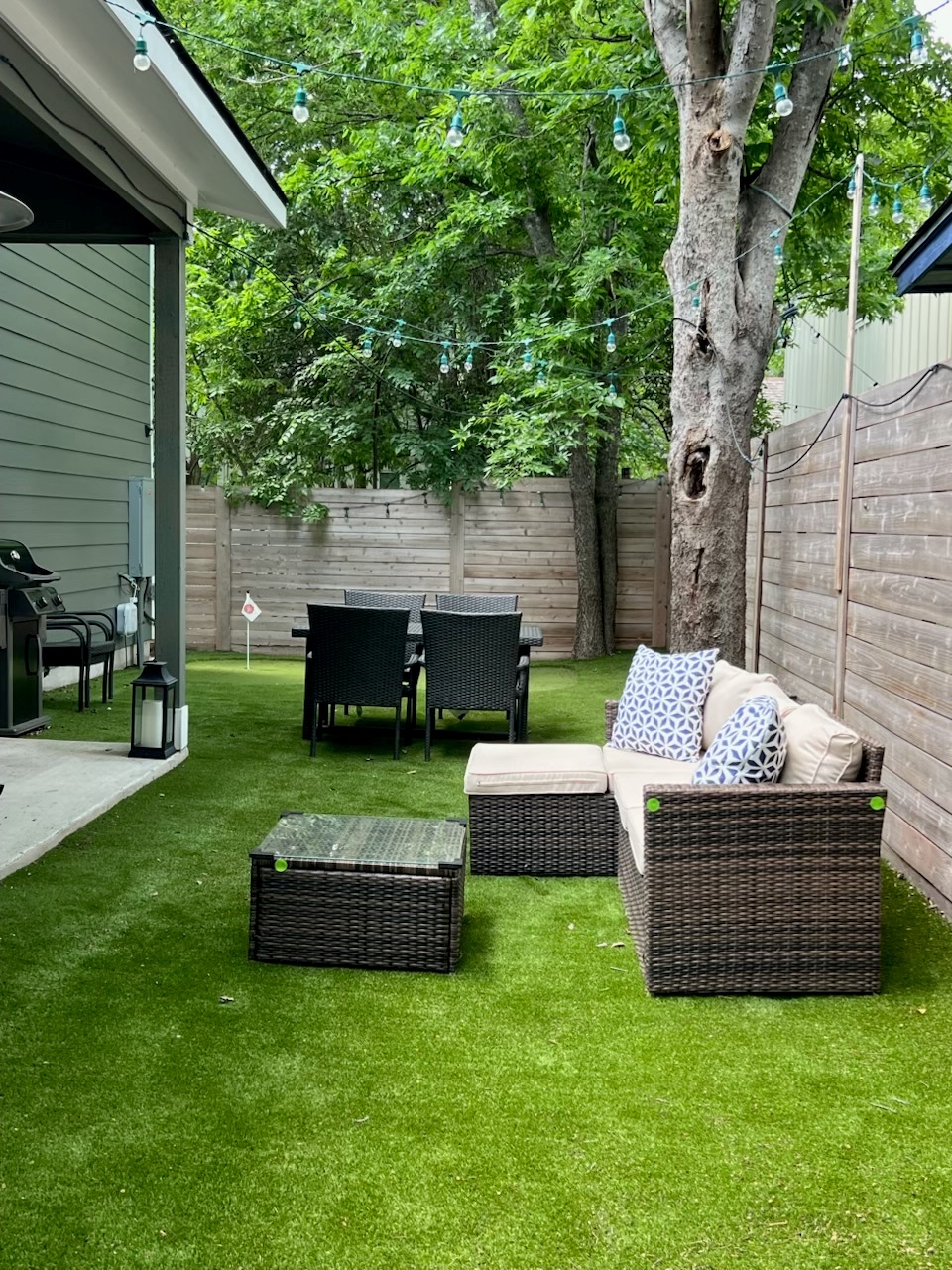 grill, sitting area, and TV in yard and patio