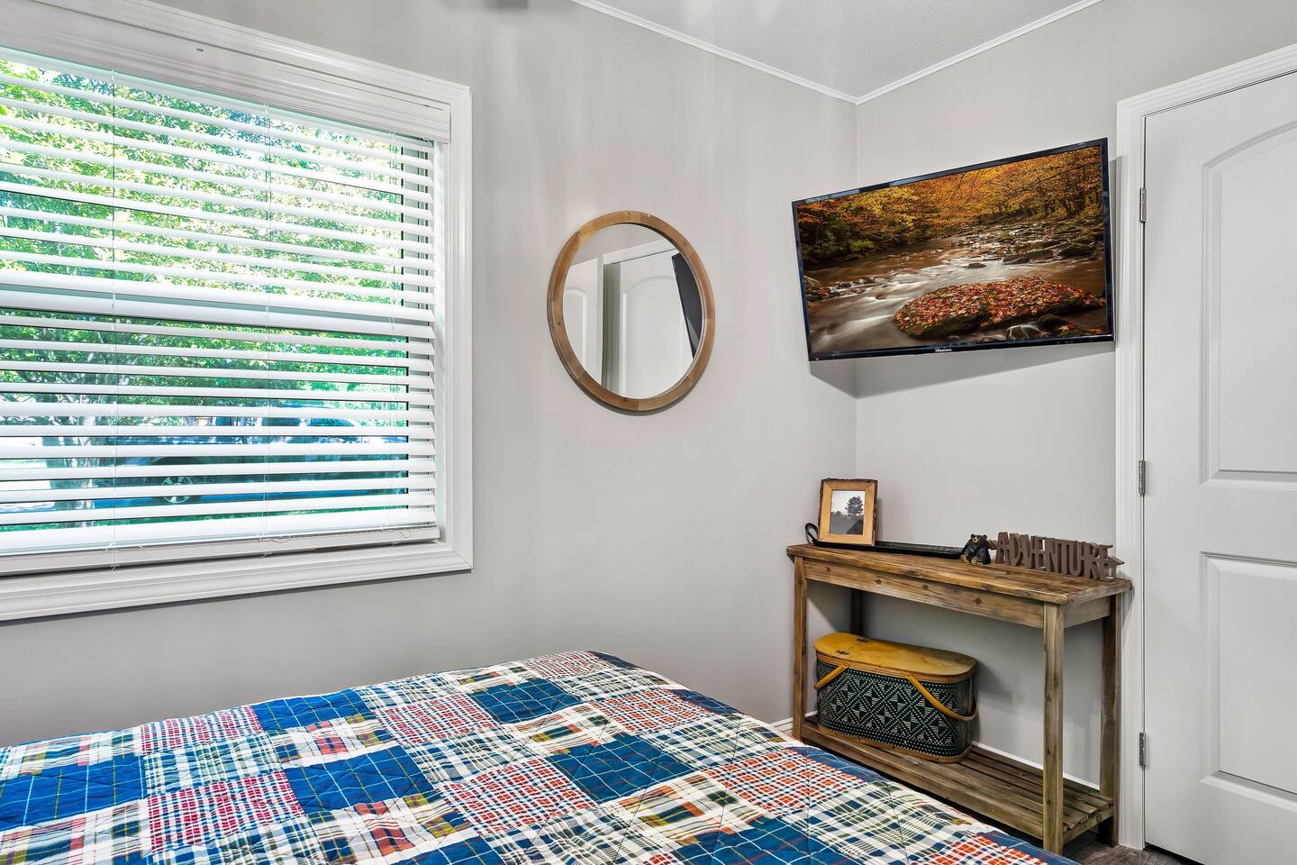 Unwind in the charming third bedroom, featuring a cozy mattress and a Samsung smart HD TV for streaming your favorite shows or movies before drifting off to sleep. #RestfulRetreat