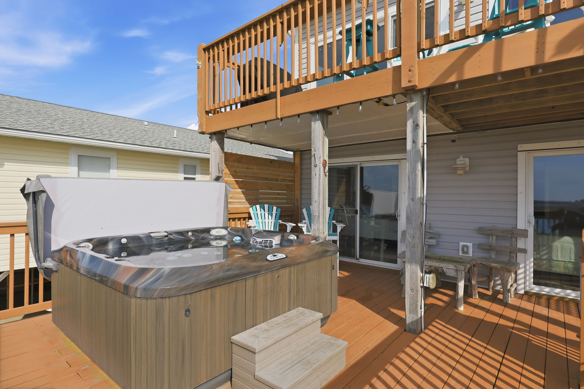 A spacious deck made for gathering, relaxing, and soaking.