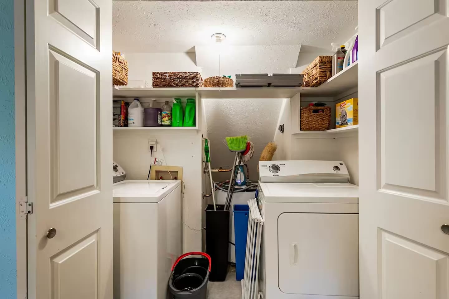 Convenient laundry room with modern washer and dryer.