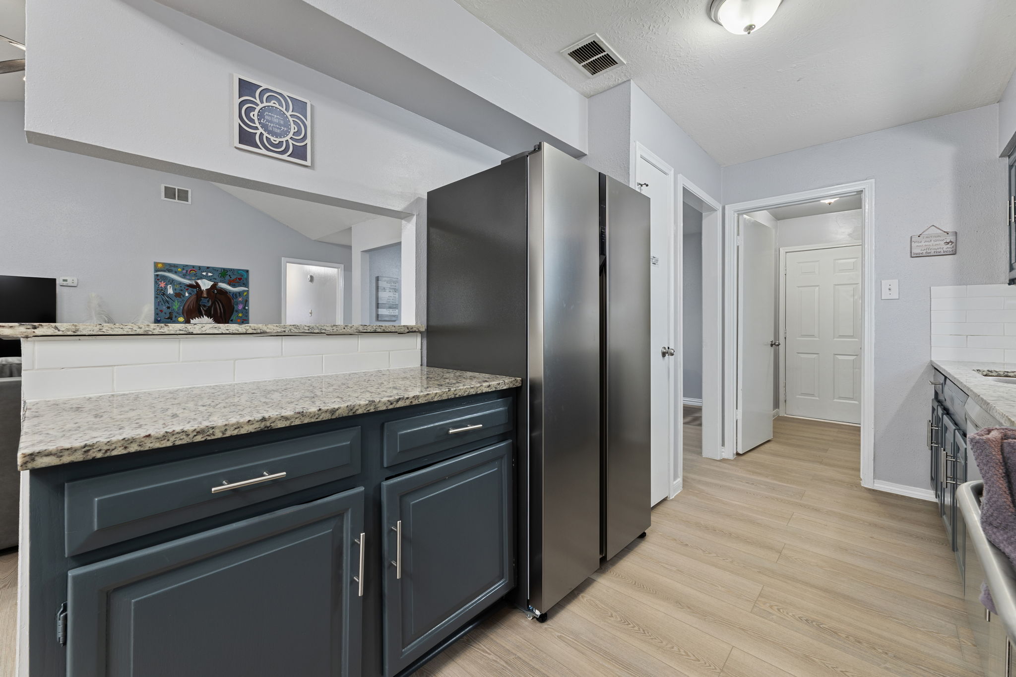 Stainless steel appliances including oven, microwave, and dishwasher