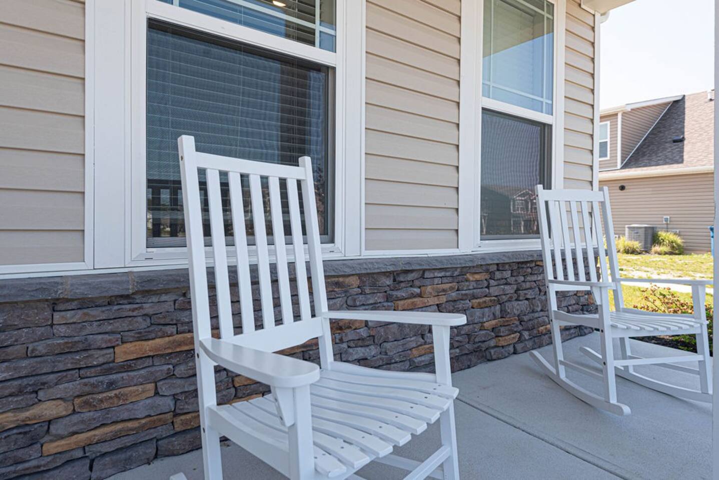Welcoming you to our abode, a covered front porch with two inviting rocking chairs invites relaxation. Here, stories unfold and memories are made, as gentle breezes and good company create the perfect sanctuary for moments of tranquility. 
