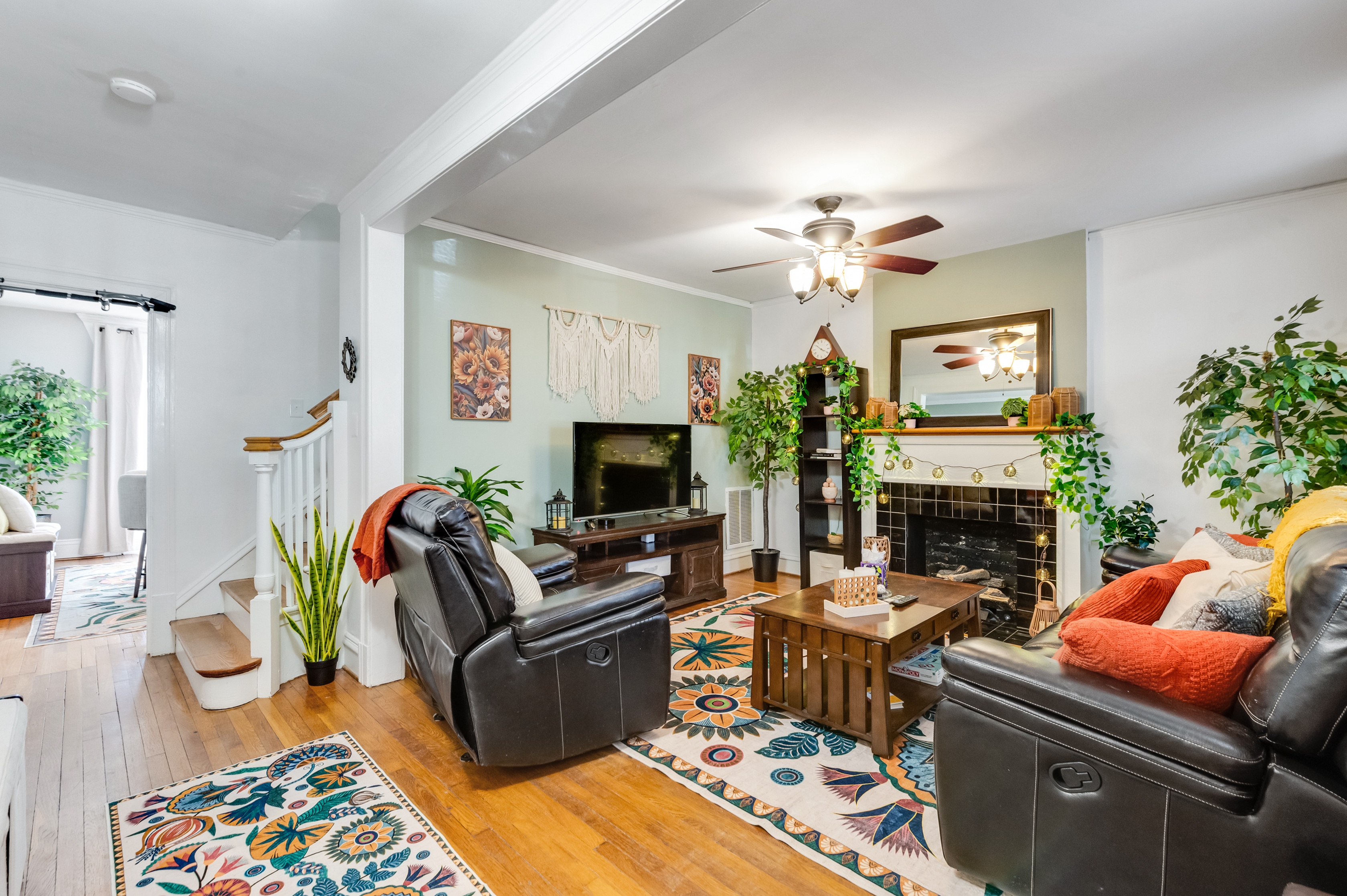 Living Room: Bright and inviting space perfect for relaxation and entertaining! Enjoy the vibrant decor.