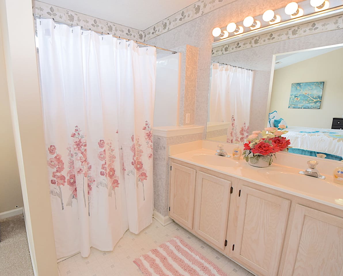 Upstairs master bedroom bathroom with a shower and jetted tub.