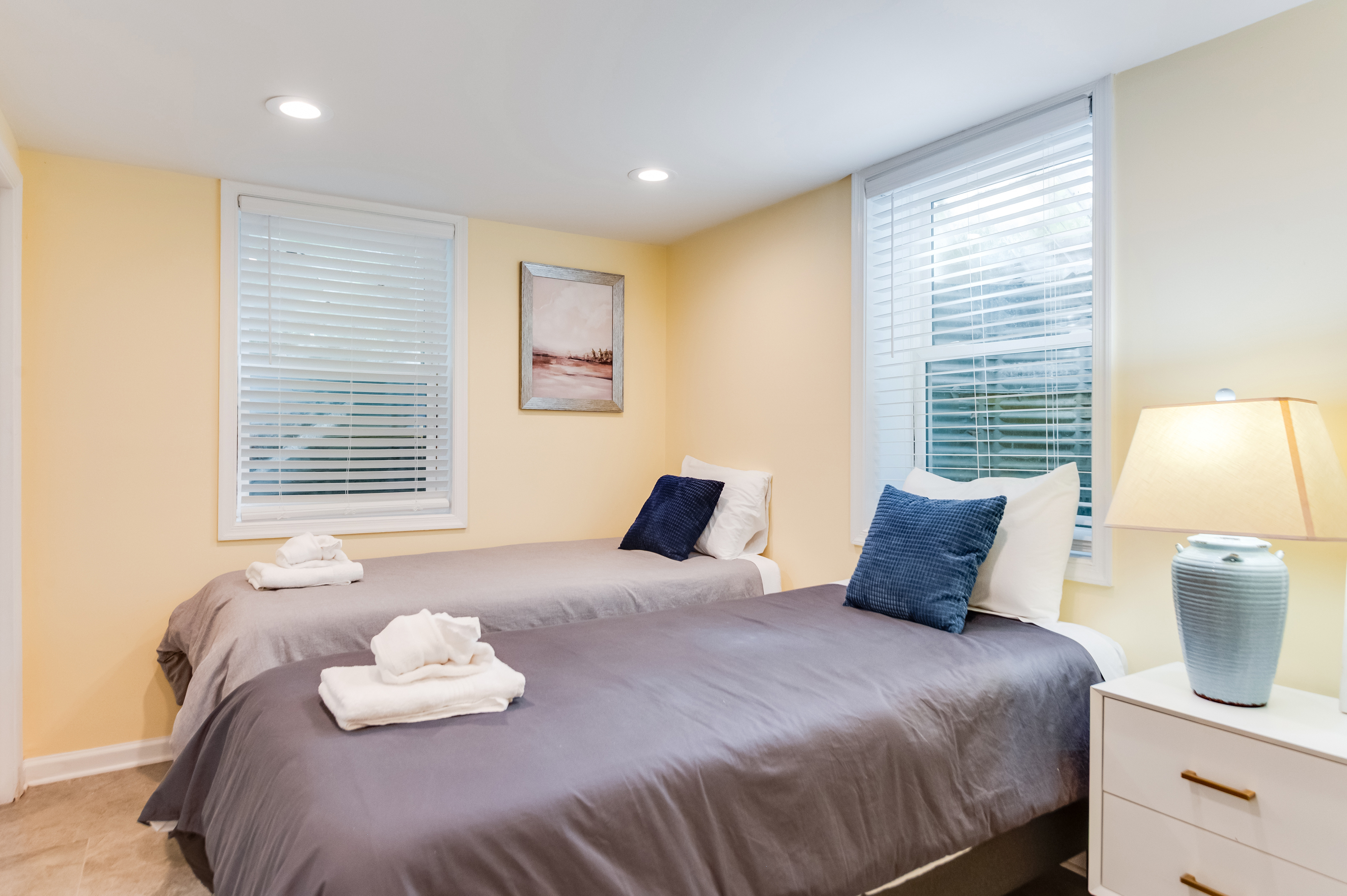Downstairs Twin Bedroom 3: Bright and airy with plush bedding and stylish decor for a refreshing stay!