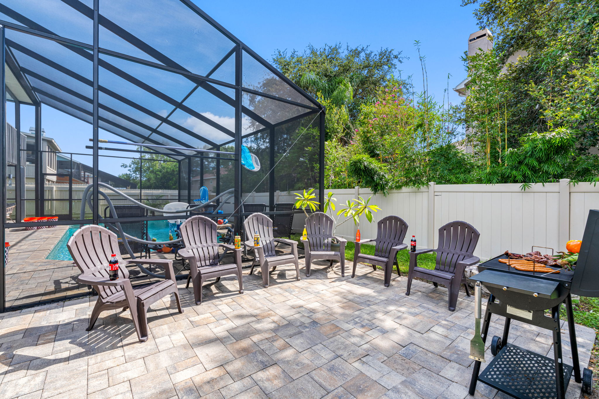 Fire up the grill and gather around the firepit! This backyard is fully equipped for outdoor feasts, complete with plenty of seating for your whole group.