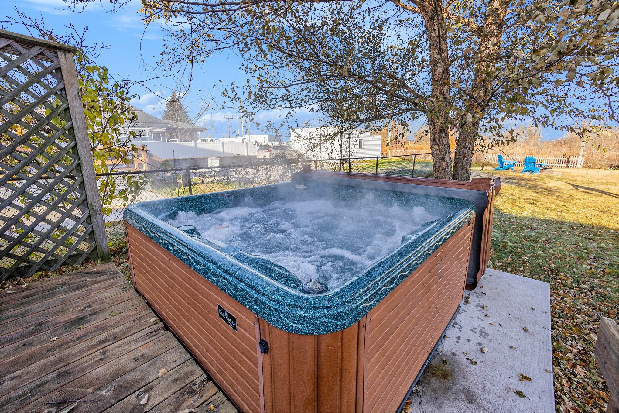 Melt away stress in your private hot tub with peaceful lake air all around