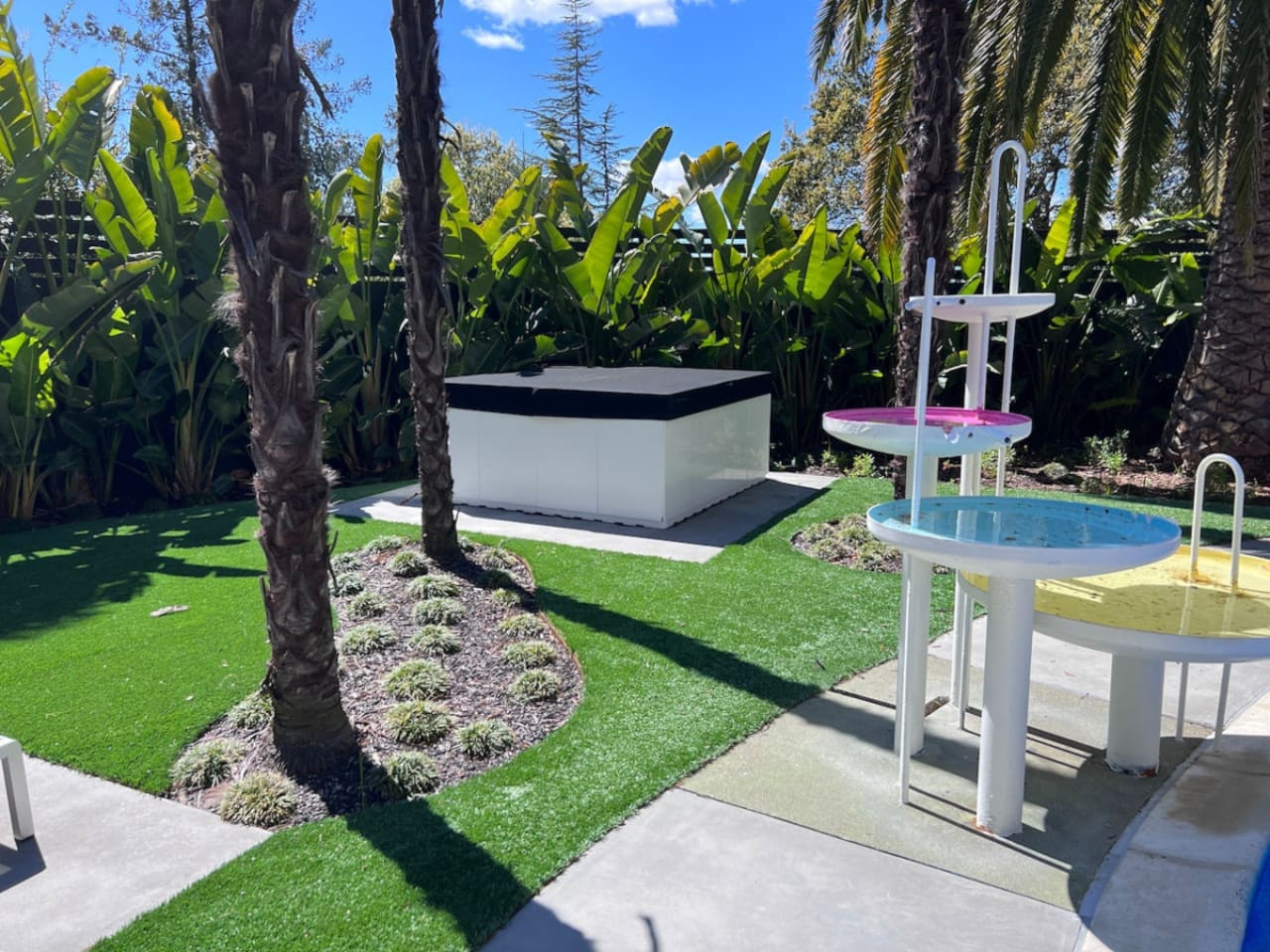 6 person luxury Aquatica hot tub is installed pool-side