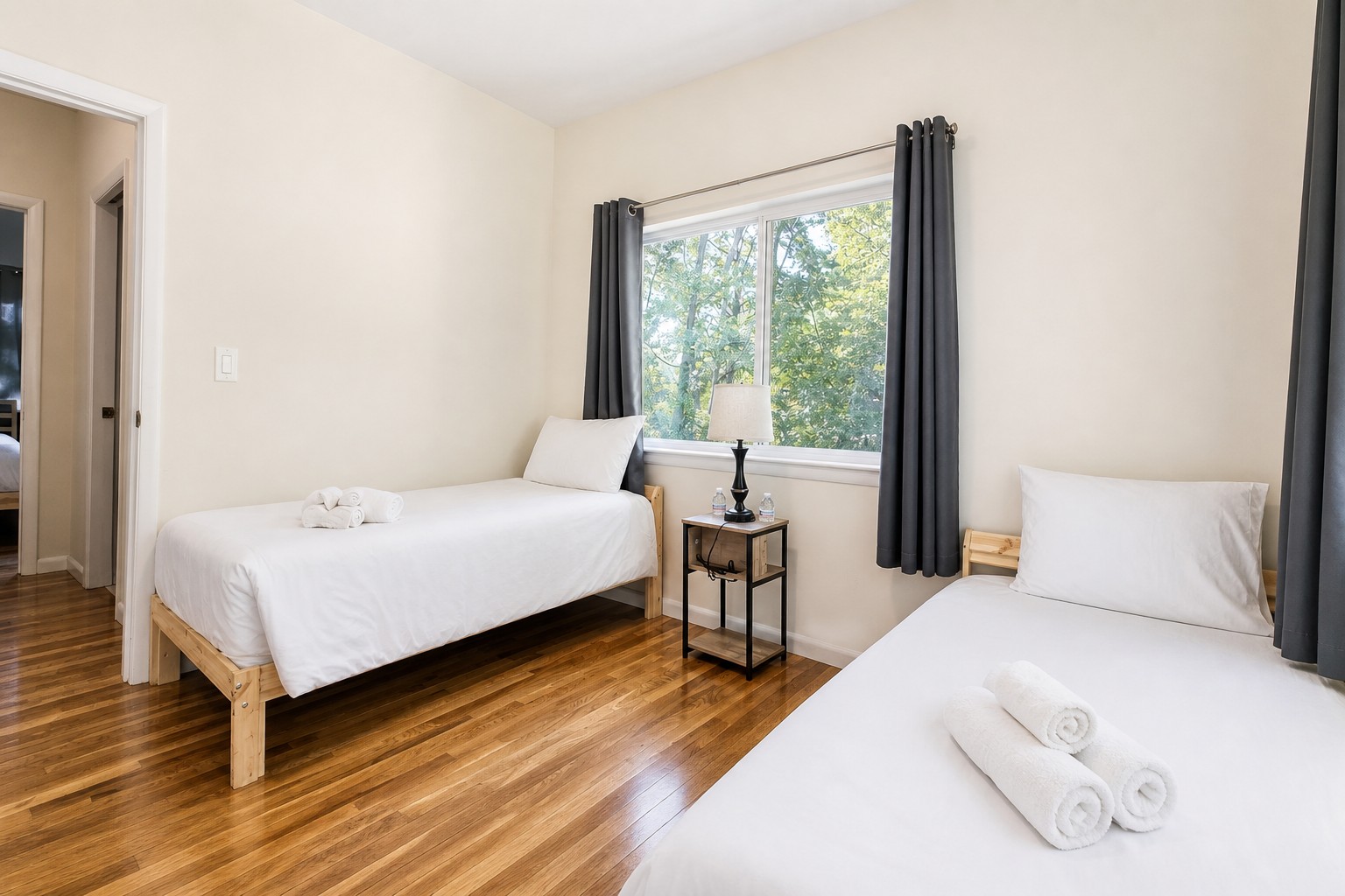 Second bedroom, two beds with the hallway just outside