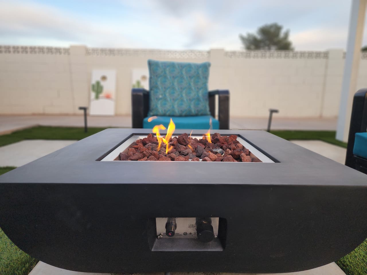 Comfortable seating around the fire pit is perfect for evening conversations and enjoying the peaceful desert atmosphere while you watch the sunset from your private backyard.