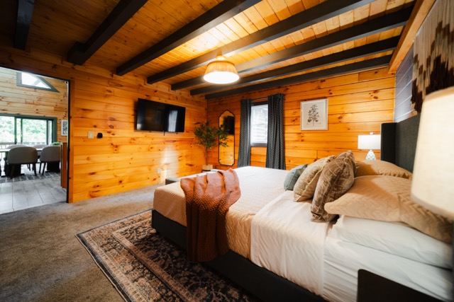The primary bedroom, featuring a TV for relaxing and unwinding in comfort.