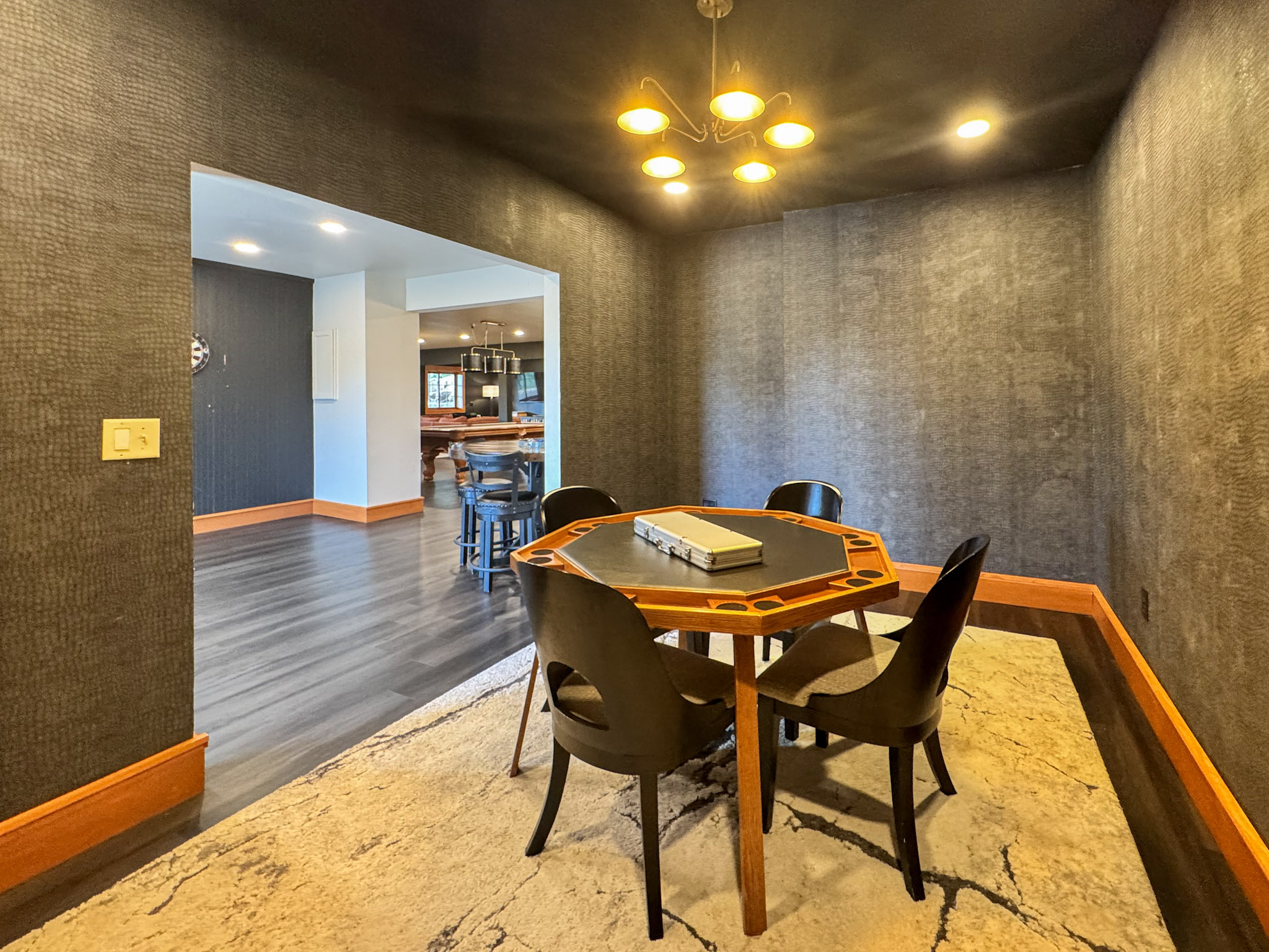 Poker room with a dedicated card table and seating.