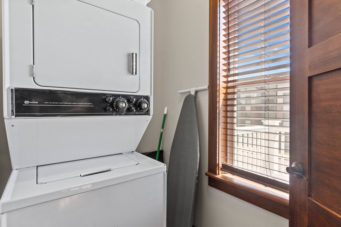 Full bathroom equipped with a washer and dryer, providing added convenience for your stay.