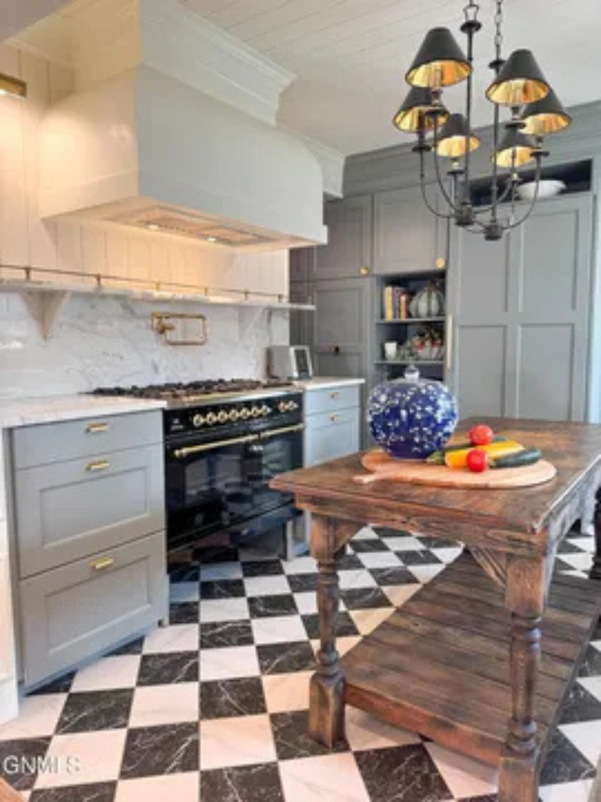 This island gives the kitchen extra room to spread out while cooking.