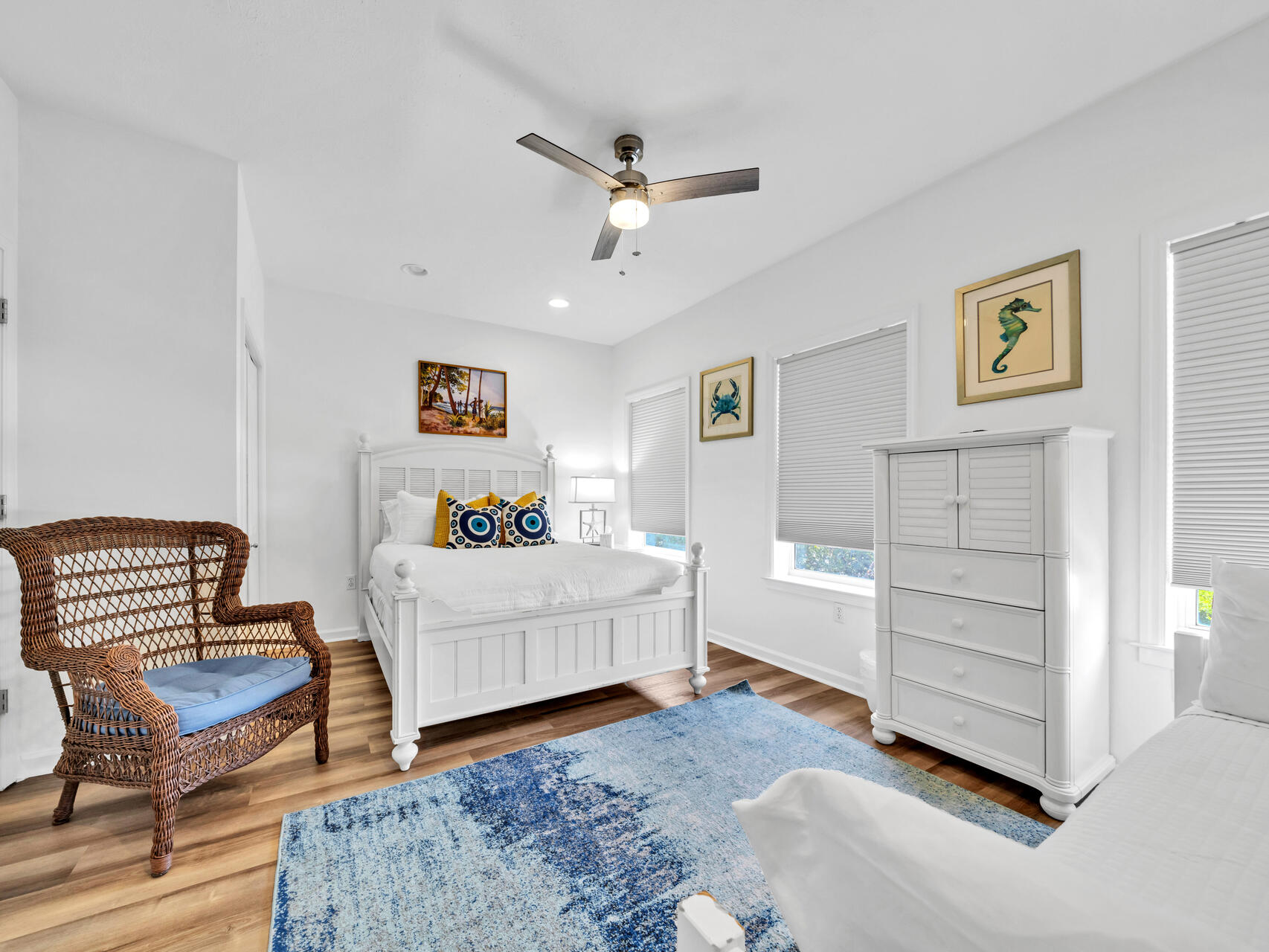 The second-floor bedroom has a queen bed and twin trundle and includes separate private access to the second-floor bathroom