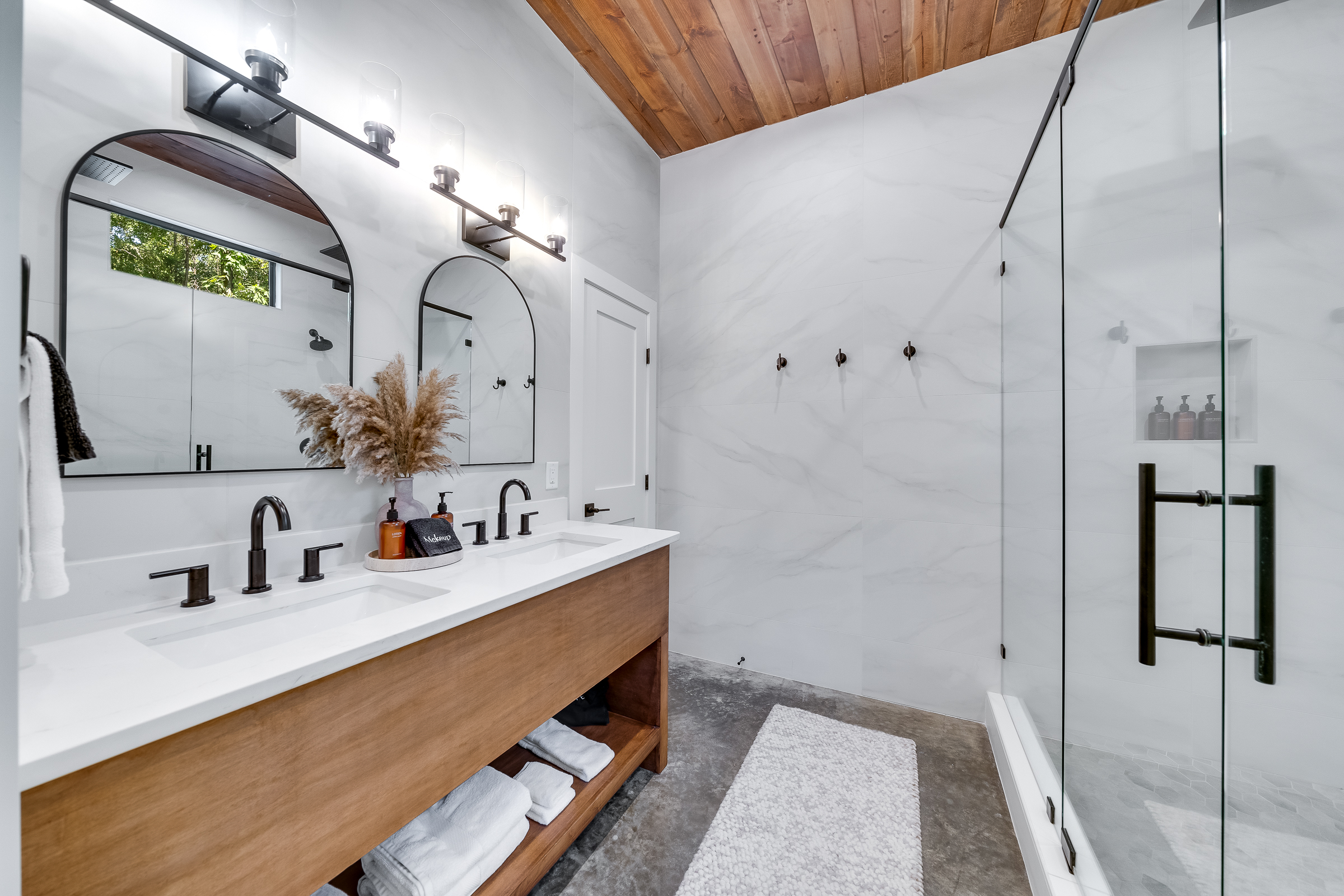 Ensuite Bathroom 3 - Attached to King Suite 3. Featuring enormous rain shower with quad showerheads, and spa-quality marble finishes. Includes premium toiletries (body wash, shampoo, conditioner, hand soap) and hotel quality towels. 