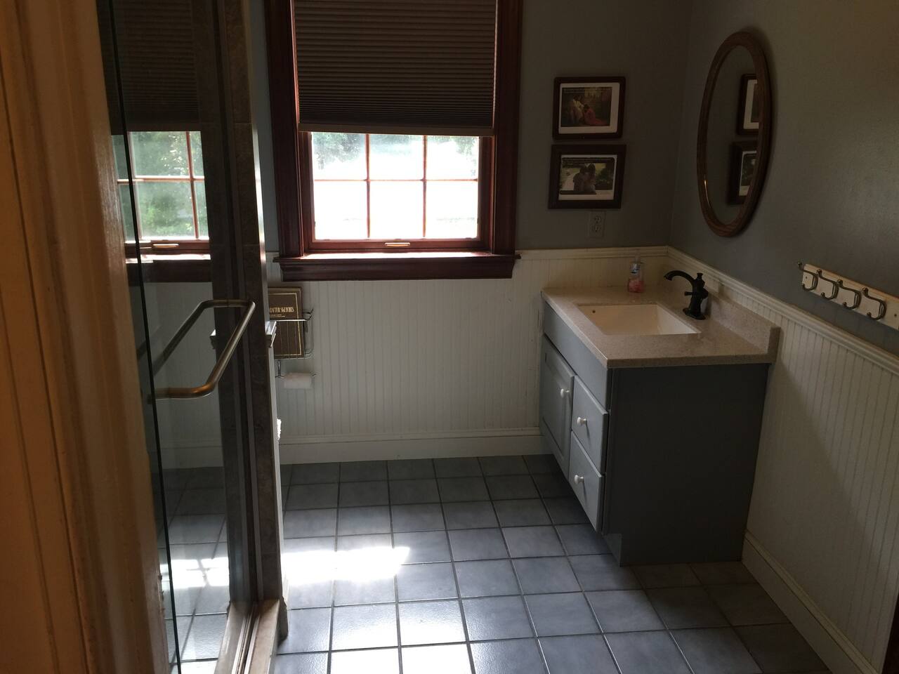 2nd bathroom on 2nd Floor that access from main hallway. Has 2 sinks and very nice  tile full shower