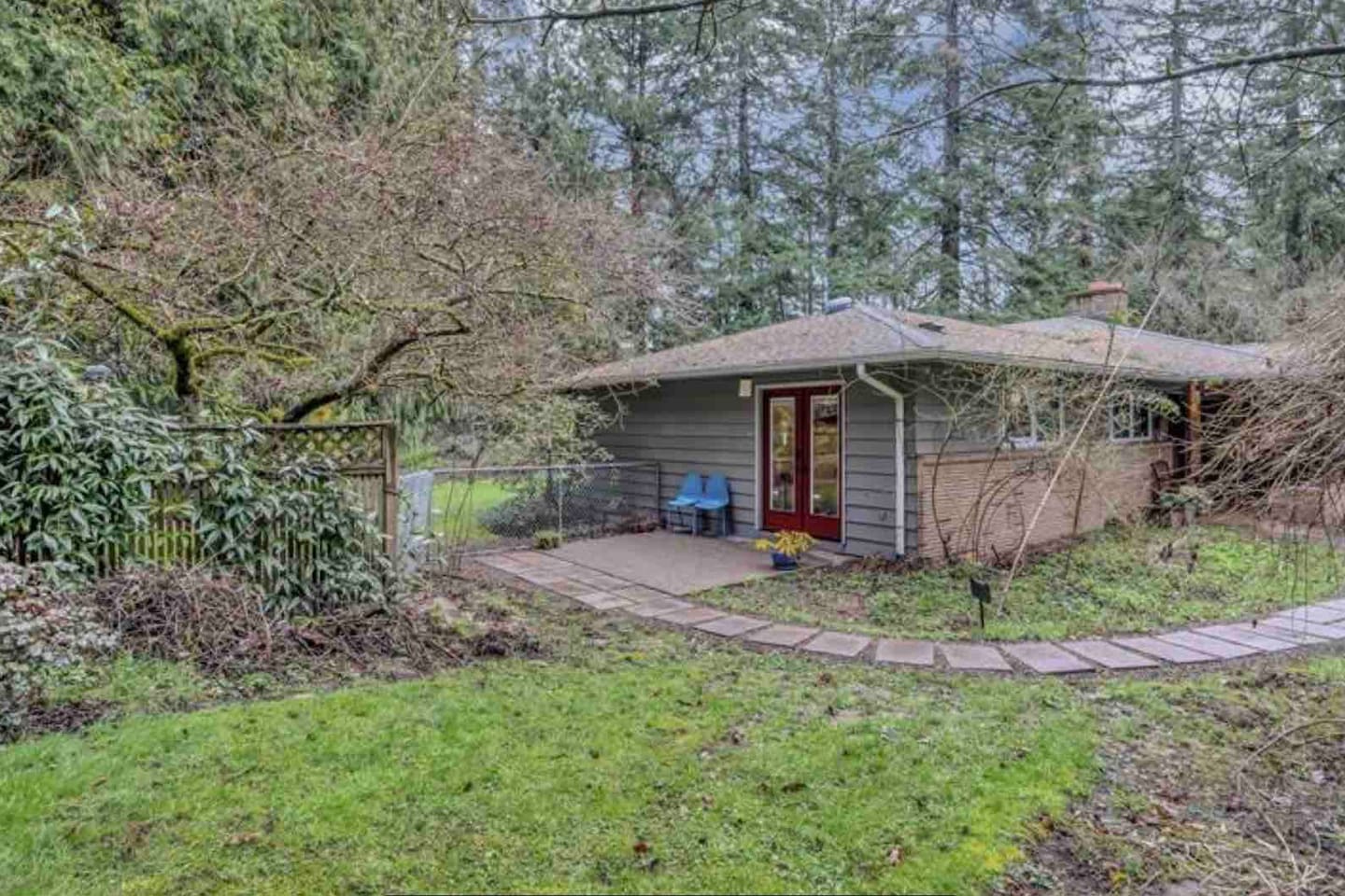 House sits above and away from street