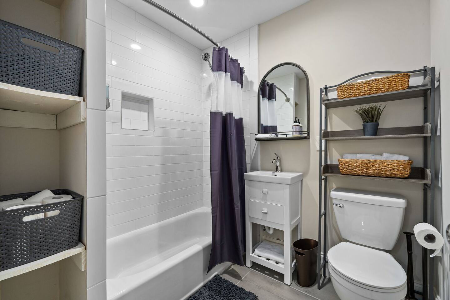 Modern and sleek, equipped with a contemporary tub and shower and essential amenities.