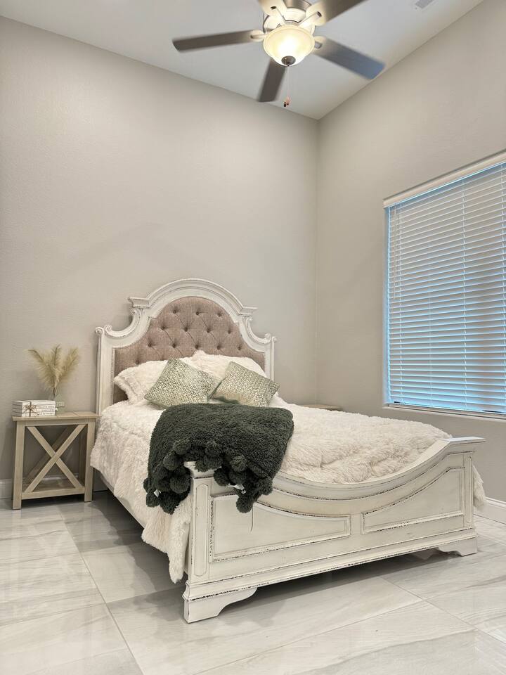 Queen bed with TV and sound system