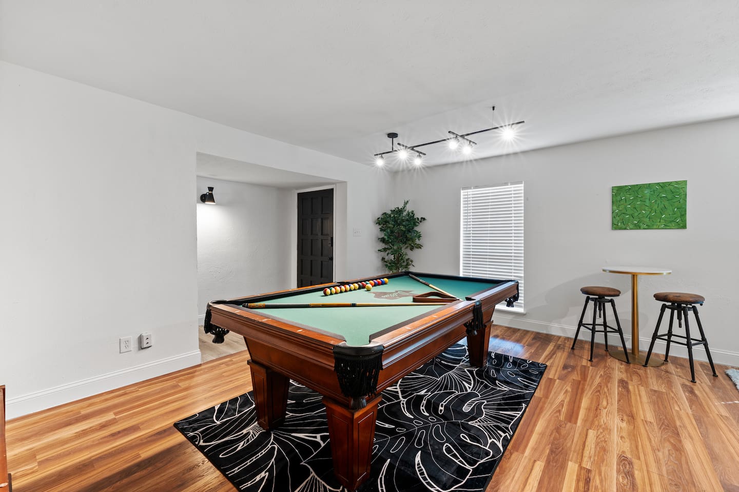 Massive game room with plenty of space for pool, seating, and game night memories.