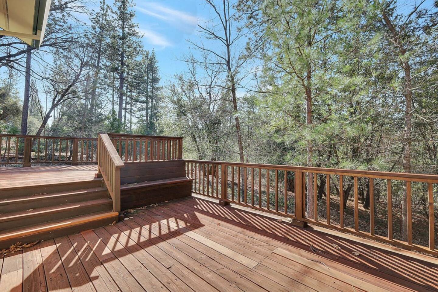 Wraparound deck with wooded views and a quiet place to enjoy fresh air outside.
