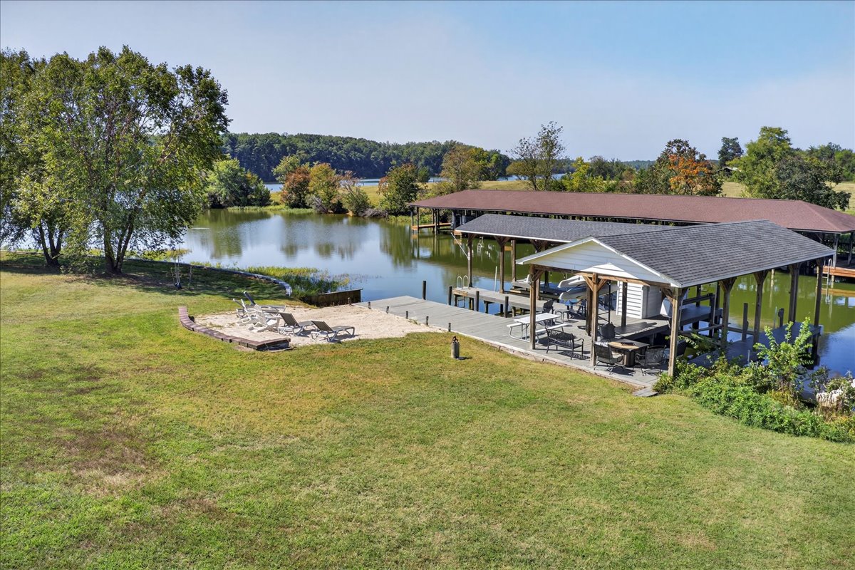 Private boathouse and sandy beach right outside your door.”