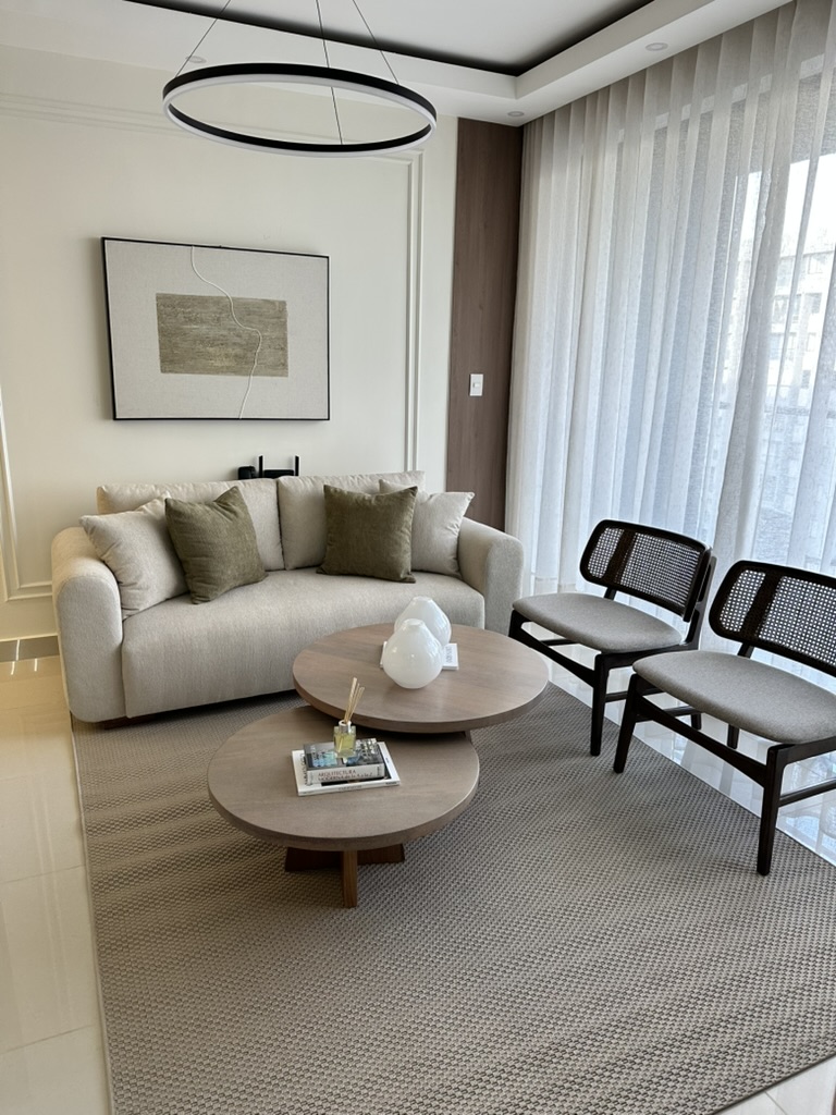 A cozy, light-filled living room made for relaxing after a day exploring Santiago. 🤍✨