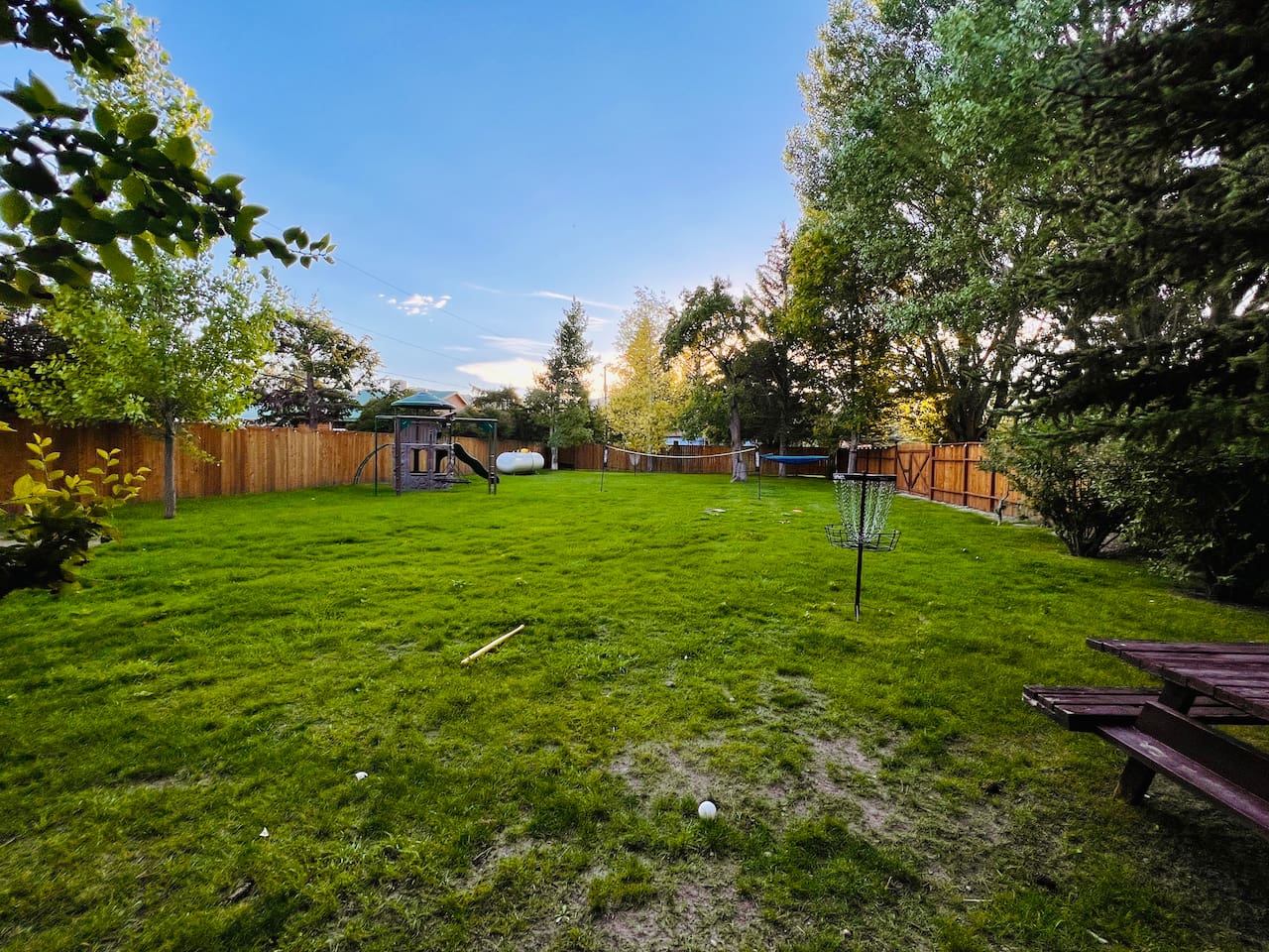 Fenced in, private and playful is the front yard made especially for family fun.