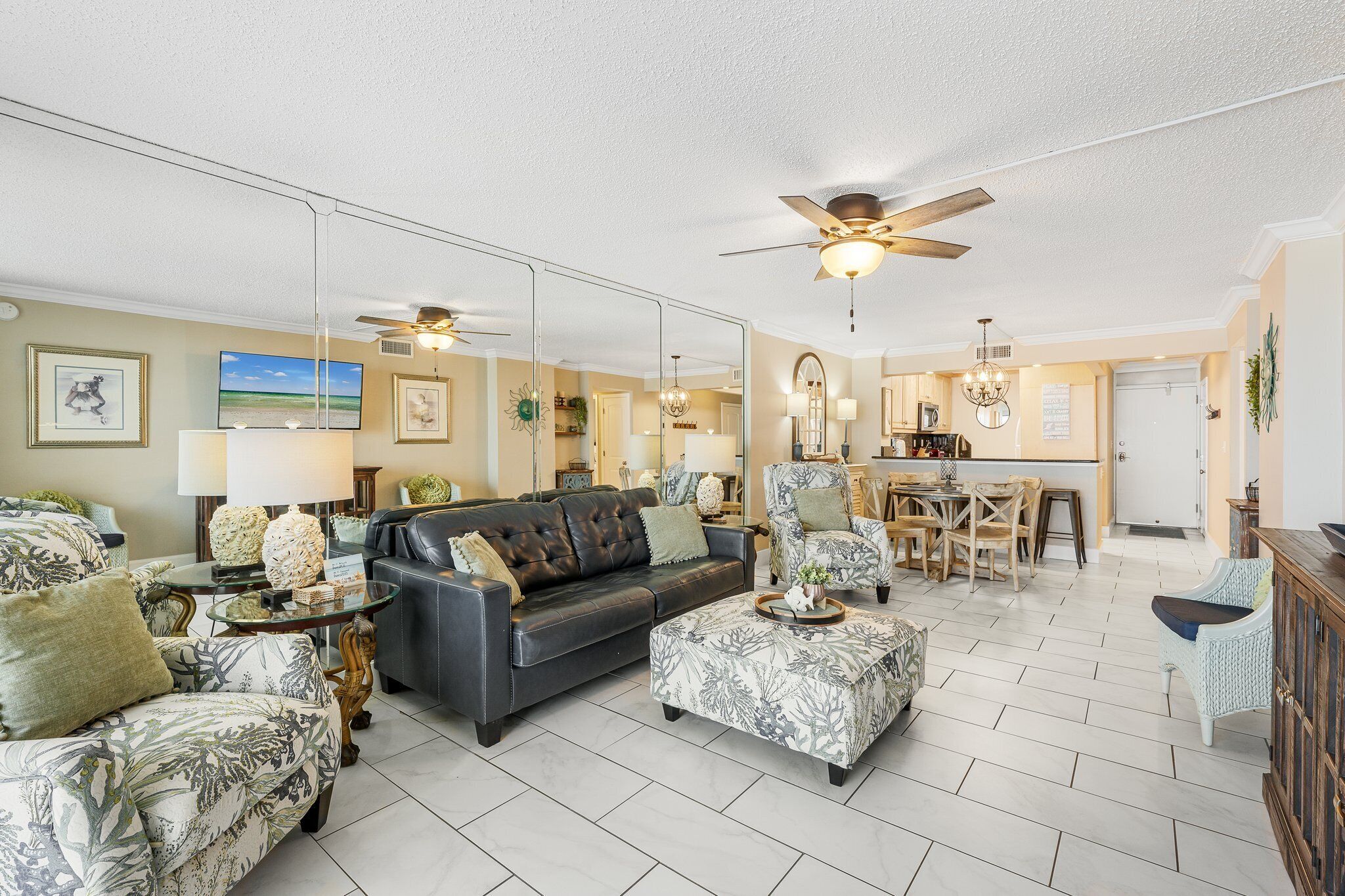 Beautiful Den space with leather sofa, ottoman, and twin recliners