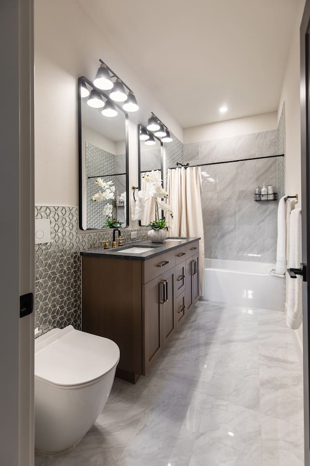 This is a full bathroom with a tub downstairs.