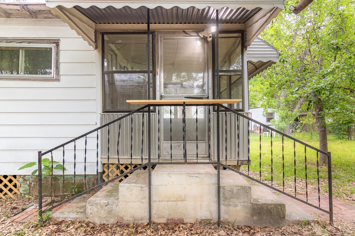 Lit main entrance into home/solarium.  