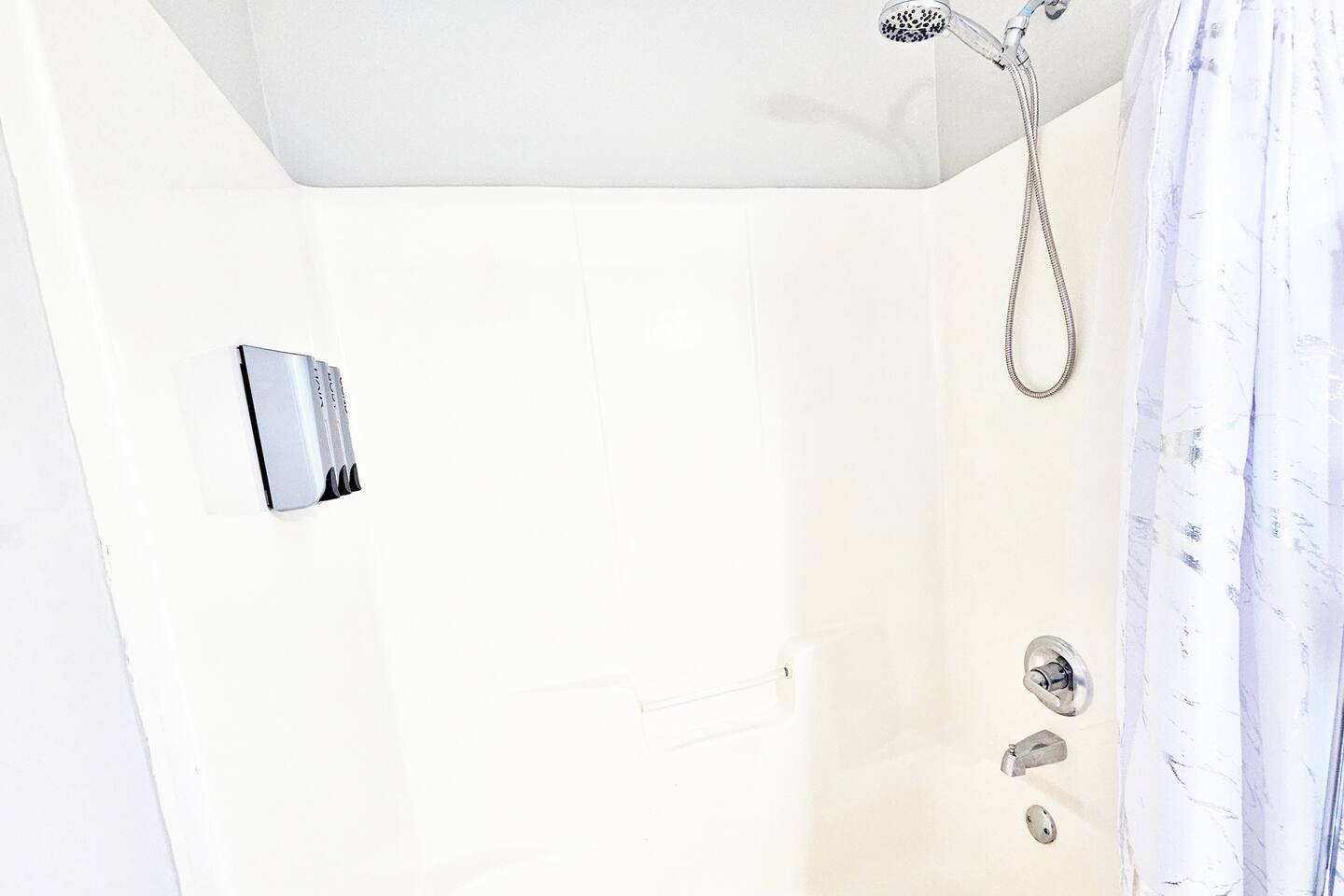 Brand new spa handheld shower head and dispensary.