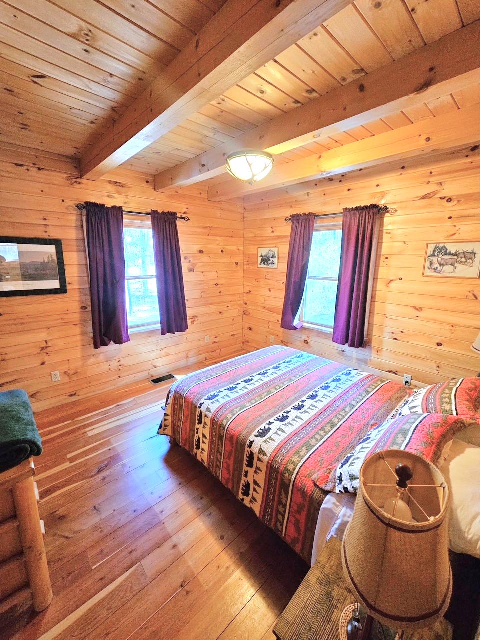 Queen bed in the main level’s bedroom.