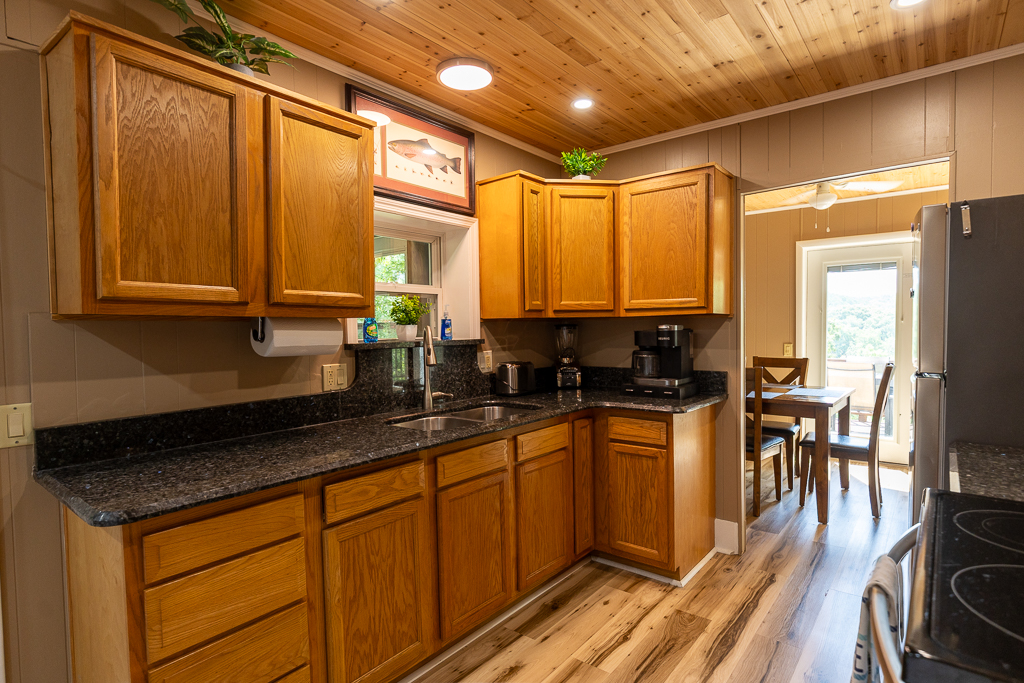 Fully equipped kitchen with stainless steel appliances, granite countertops, and plenty of cabinet space for your stay.
