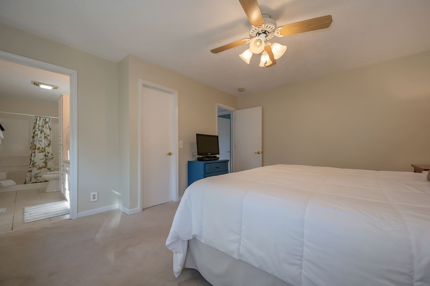 Primary bedroom with king bed and private full bath